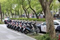 Police cars and motocycles placed neatly by the road