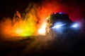 Police cars at night. Police car chasing a car at night with fog background. 911 Emergency response