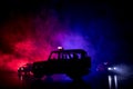 Police car chasing a car at night with fog background. 911 Emergency response police car speeding to scene of crime. Selective foc Royalty Free Stock Photo