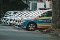 police cars parked along side of a street in front of some houses Royalty Free Stock Photo