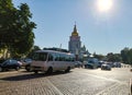 Police cars are parked on Mikhailovskaya Square on a sunny day.