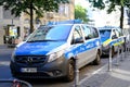 police cars on streets of germany, law enforcement officers guarding order on vehicles, patrolling, sending law enforcement