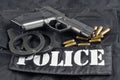 Police concept - handgun on black uniform Royalty Free Stock Photo