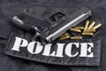 Police concept handgun on black uniform background Royalty Free Stock Photo