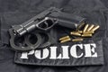 Police concept handgun on black uniform background Royalty Free Stock Photo