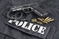 Police concept handgun on black uniform background Royalty Free Stock Photo