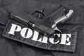 Police concept - handgun on black uniform Royalty Free Stock Photo