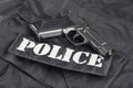 Police concept - handgun on black uniform Royalty Free Stock Photo