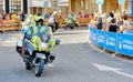 Police control safety of bike riders and spectators during La Vuelta competition