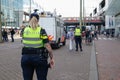 Police cordoning off area to stop people protesting on the streets against lockdown measures by the dutch government in the city