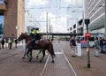 Police cordoning off area to stop people protesting on the streets against lockdown measures by the dutch government in the city