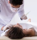 Police coroner examining dead body corpse in morgue Royalty Free Stock Photo