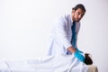 Police coroner examining dead body corpse in morgue Royalty Free Stock Photo