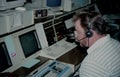 A police dispatcher dispatches to police cars
