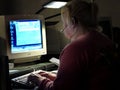 Police dispatcher using a computer to dispatch units to calls for help