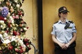 Police in front of gate of flowers Royalty Free Stock Photo