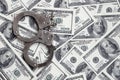 Police handcuffs lie on a lot of dollar bills. The concept of illegal possession of money, illegal transactions with US dollars. Royalty Free Stock Photo