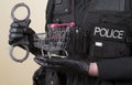 Police handcuffs and a supermarket trolley Royalty Free Stock Photo