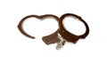 Police handcuffs on a white background. Close-up Royalty Free Stock Photo