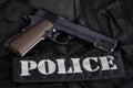 Police handgun on black uniform Royalty Free Stock Photo