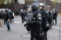 Police in heavy riot gear during civil disturbance Royalty Free Stock Photo