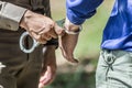 Police helped to catch the guilty and lock the handcuffs,arrested Royalty Free Stock Photo