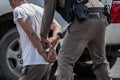 The police helped to catch the guilty and lock the handcuffs,Arrested. Royalty Free Stock Photo
