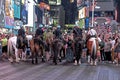 4 Police Horsemen holding the crowds on Times Square Royalty Free Stock Photo