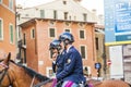 Police on horses are watching and helping the spectators at the