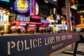 Police line crime scene in New York City with blurry background