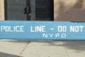 Police line, do not cross, NYPD blue wooden barricade on closed street in the Bronx, New York City Royalty Free Stock Photo