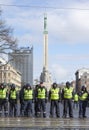 Police line infront Freedom Monument in Riga, Latvia