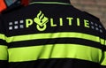 Police logo on the back of an agent on the uniform in the Netherlands