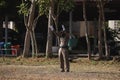 Police marshaller is Marshalling signals to Helicopter Landing at Field