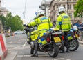 Police motorcycle officers on stand-by at road block outside Parliament Square, London,UK.