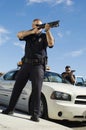 Police Officer Aiming Shotgun Royalty Free Stock Photo