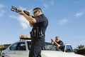 Police Officer Aiming Shotgun Royalty Free Stock Photo