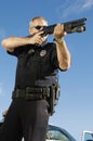 Police Officer Aiming Weapon Royalty Free Stock Photo