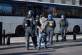 Police officer, arrest and person in street for crime, safety and bus for crowd control in city. People, law enforcement Royalty Free Stock Photo