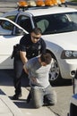 Police Officer Arresting Young Man Royalty Free Stock Photo