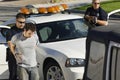 Police Officer Arresting Young Man