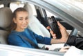 Police officer with breathalyzer and woman in car. Alcohol consumption while driving Royalty Free Stock Photo