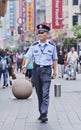 Police officer in city center, Shanghai, China