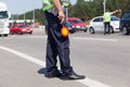 Police officer controlling traffic on the highway Royalty Free Stock Photo