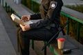 Police officer eating donut in park closeup Royalty Free Stock Photo