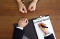 Police officer examining criminal record at desk