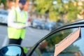 Police officer giving a fine for parking violation