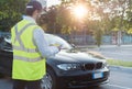 Police officer giving a fine for parking violation Royalty Free Stock Photo