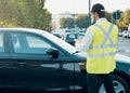 Police officer giving a fine for parking violation Royalty Free Stock Photo