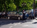 Police officer guards parking lot, Paris, France